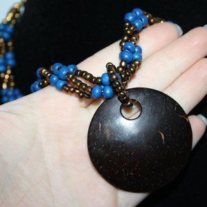 Beautiful gold and blue beaded necklace w coconut